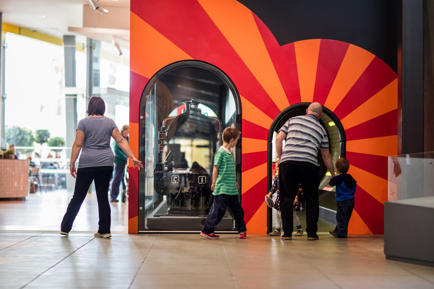 Family entering the Children's Gallery via the train tunnel