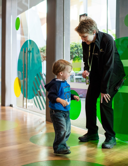 A toddler and a customer service officer