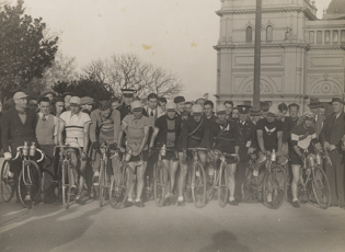 Group of Bicycle Riders with Exhibition Building in the background, Carlton, 1920s-1930s.