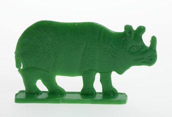 Green plastic toy rhinoceros. 