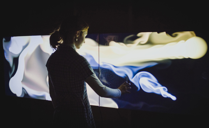Member of JBoard engaged in testing new exhibits for Beyond Perception: Seeing the Unseen.