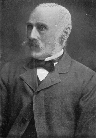 Portrait of a man with moustache, coat and bow tie