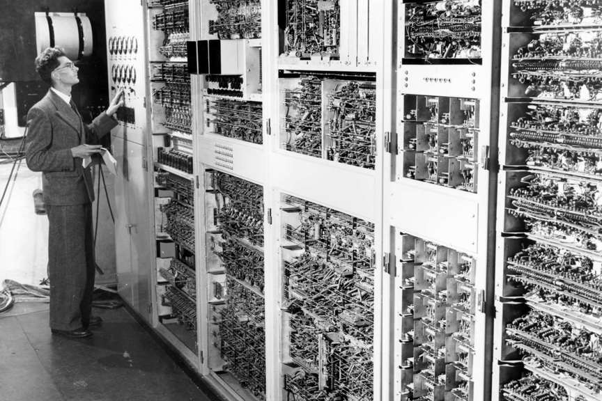 Man operating early computer