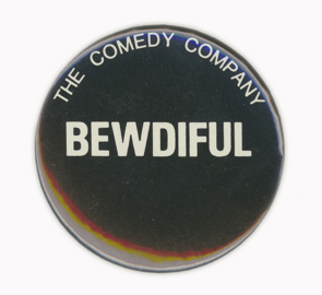 Round badge saying “Bewdiful, The Comedy Company”