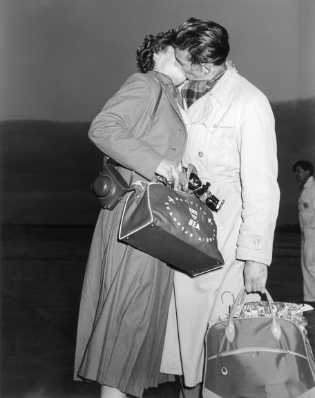 German migrants embracing, 1956.