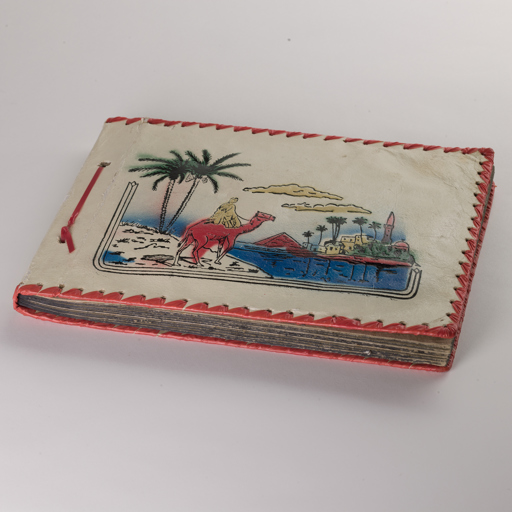 Leather bound scrap book purchased in Port Said and used on a voyage from England, 1961.