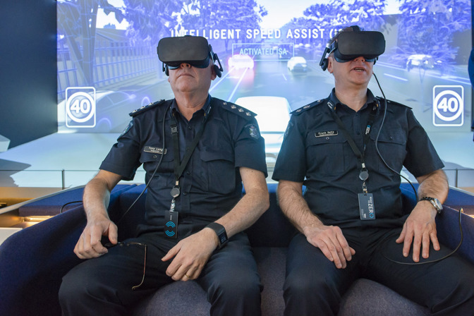 Two police officers with VR headsets on