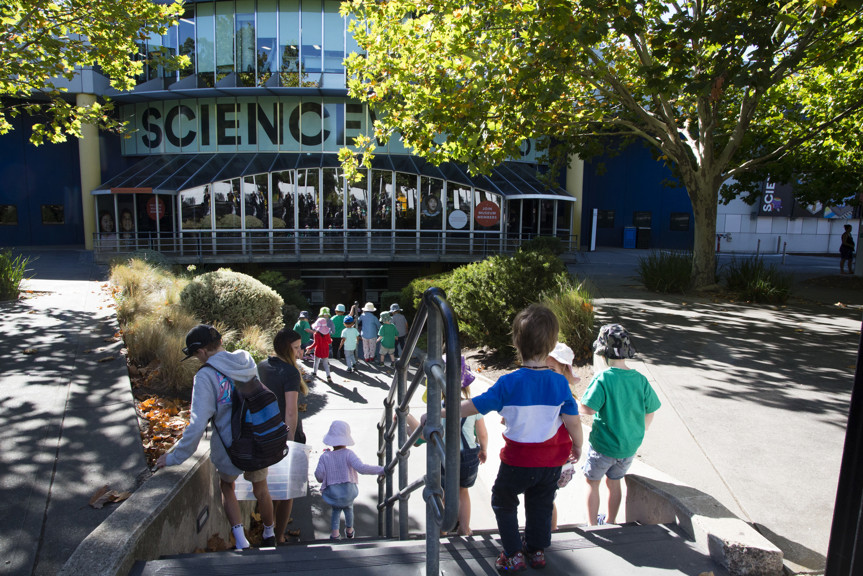 Group of children walking toward the schools entrance at Scienceworks.
