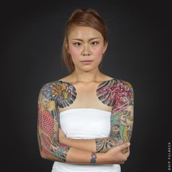 Woman with tattoos on her arms