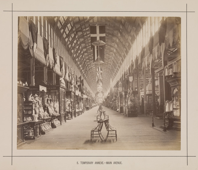 Main avenue of the temporary annexe to the Royal Exhibition Building during the Melbourne International Exhibition of 1880. Caption reads: 5. Temporary Annexe.- Main Avenue