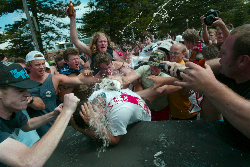 An angry mob bash and smash beer bottles on head of an innocent man at North Cronulla beach on Sunday 11 December 2005. 