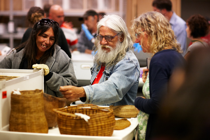 Yulendj members Lisa Jones and Elder Larry Walsh talk with curator Rosemary Wrench in the First Peoples collection store.