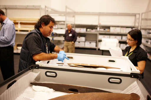 Yulendj member Brendan Kennedy talks with curator Louise Gray about First Peoples exhibition objects. Elder Sandy Atkinson is in the background.