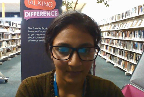 woman with glasses in a library