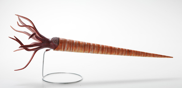Model of sea animal with a long orange cone shell and ten tentacles