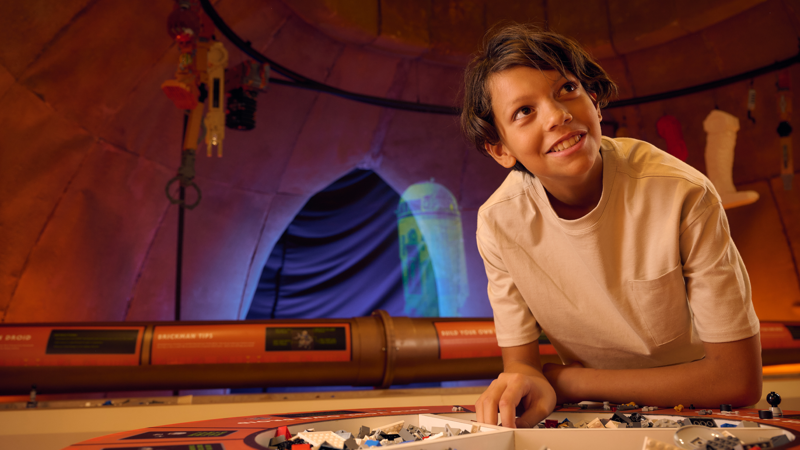 A boy plays with LEGO in LEGO Star Wars Exhibition at Melbourne Museum.