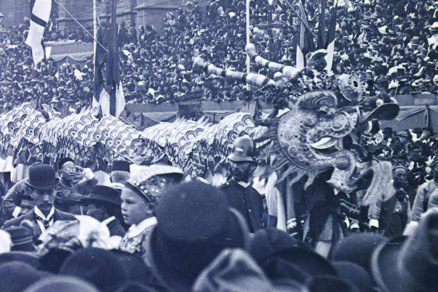 a black and white image of a Chinese parade dragon