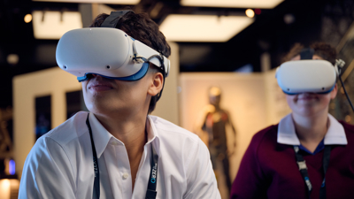 Two students in the Road to Zero Experience Space wearing virtual reality headsets 