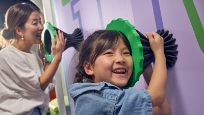 A mother and daughter send a secret message over the airwaves with whisper tubes.