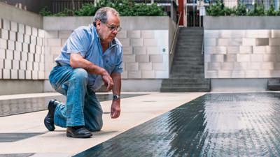  Visitor in Tribute Garden at Immigration Museum.