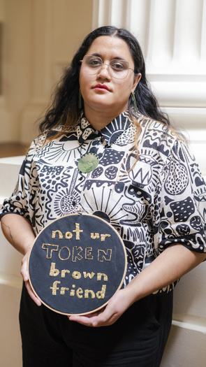 Maria Birch-Morunga​ posing with her art