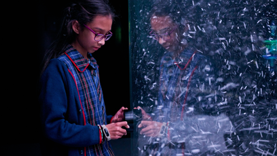 Student engages with an air flow interactive in the Beyond Perception exhibition.