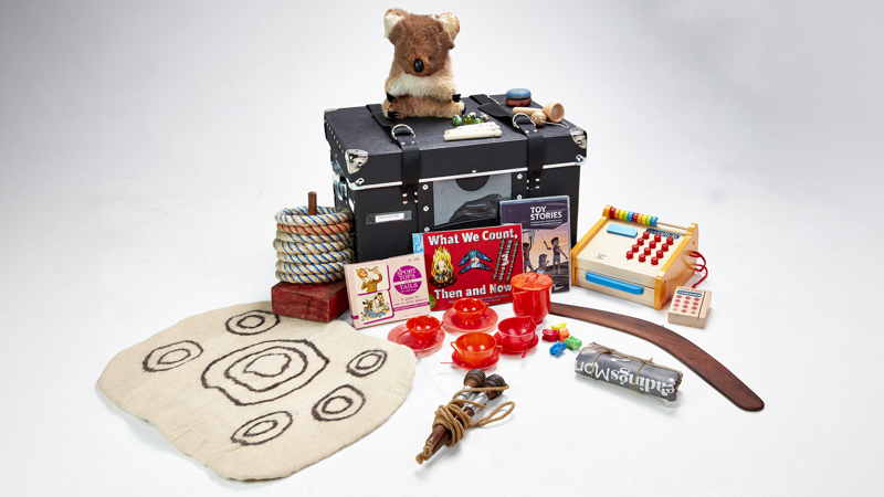 A black case with a variety of toys layout beside it