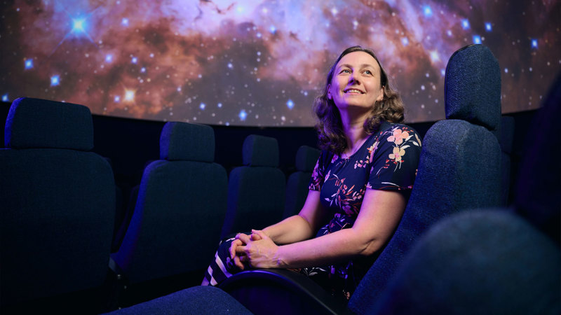 Tanya Hill sits on a seat in the Scienceworks Planetarium.