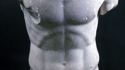 The limbless and headless statue of a torso of an athletic male.