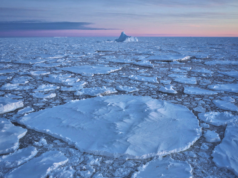 Oblong shaped icebergs in pack ice, north of Mawson Station, Antarctica
