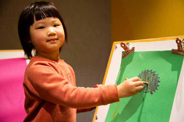 Child creating their own story of Caring for Country by colouring a native animal in the Energy LAB, during the Little Kids Day In - Caring for Country program at Scienceworks, August 2022.