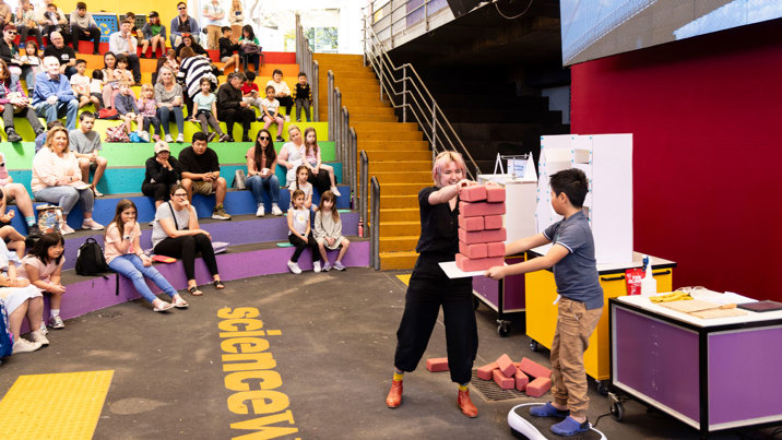 Volunteers helping our presenter in the Building vs Wild amphitheatre show 