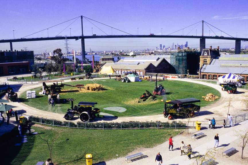 Overhead view (from roof of main building) of stationary and mobile steam machinery displays on the arena as part of the Pumping Station Festival at Scienceworks, 1995.