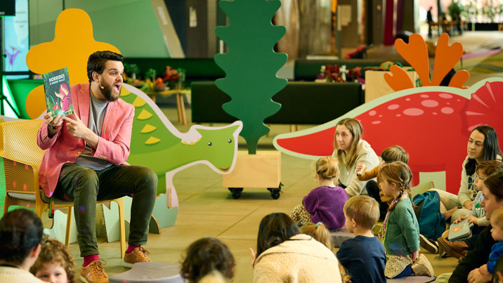 Children being read to at Dino Days.