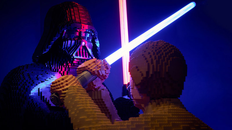 The Sith Lord Darth Vader and Jedi Luke Skywalker crossing lightsabers in a duel LEGO for LEGO® Star Wars: The Exhibition at Melbourne Museum.