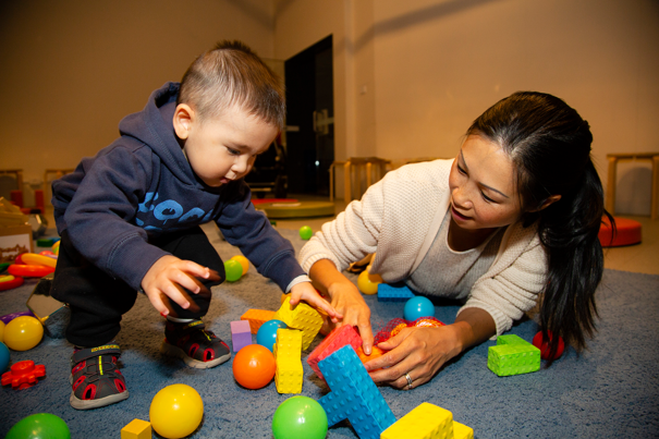 Mother and small child playing with blocks at Tiny Tinkerers at Scienceworks.
