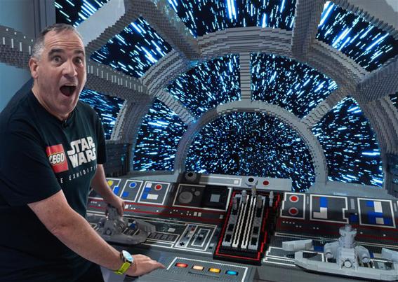 Ryan ‘Brickman’ McNaught in the Millenium Falcon cockpit made from lego in LEGO® Star Wars: The Exhibition at Melbourne Museum.