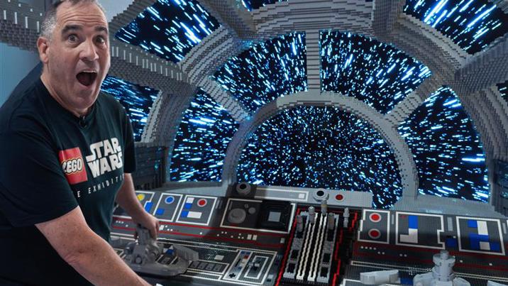 Ryan ‘Brickman’ McNaught in the Millenium Falcon cockpit made from lego in LEGO® Star Wars: The Exhibition at Melbourne Museum.