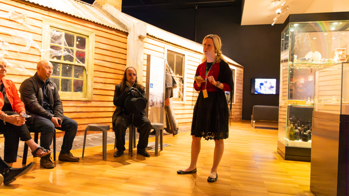 A collections manager gives a talk outside Little Lonsdale exhibition during Halloween at the Museum.