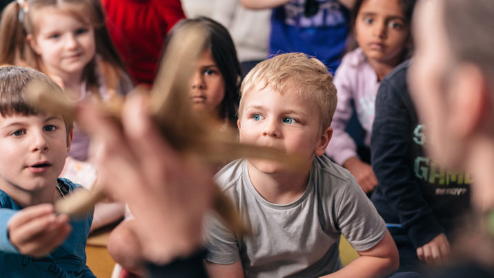 Children learn about a sea star in the Ocean Wonders presentation..
